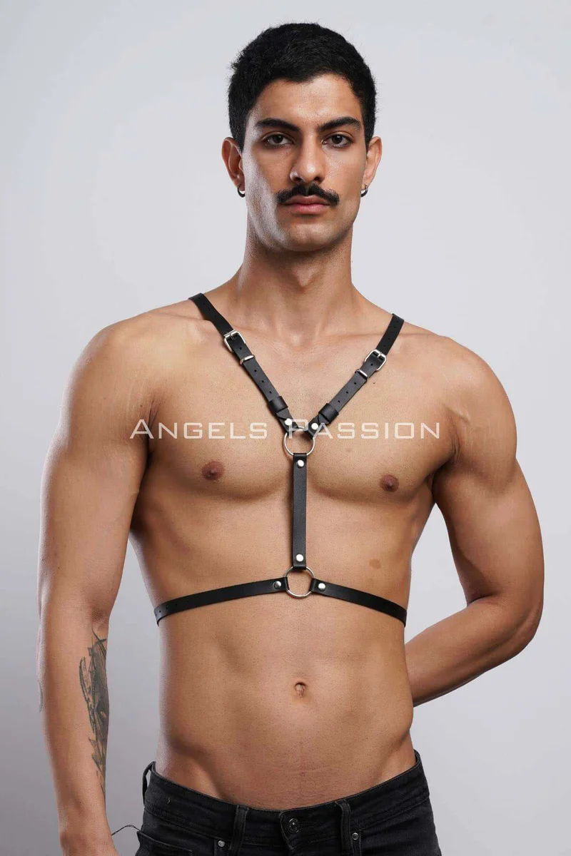 Bat wing shoulder detail on black faux leather harness close-up