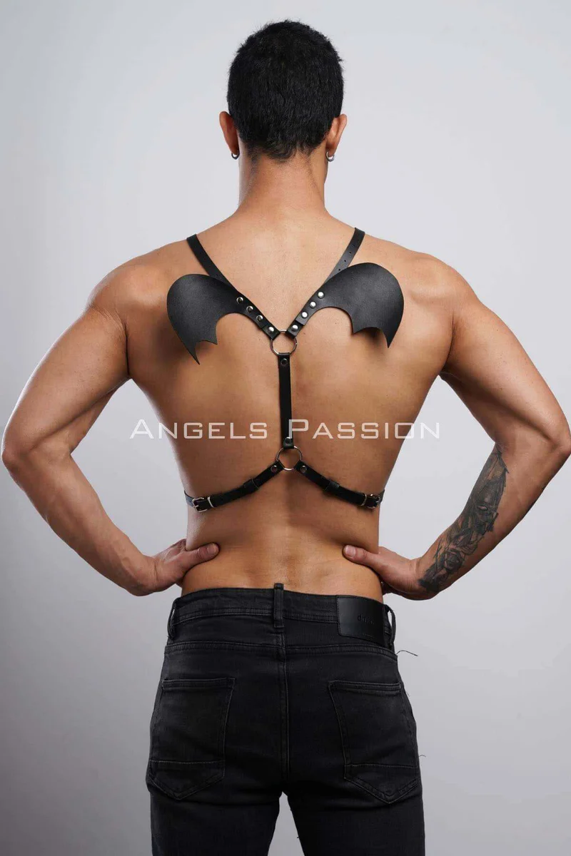 Black bat wing body harness detail of buckle closure on adjustable torso strap