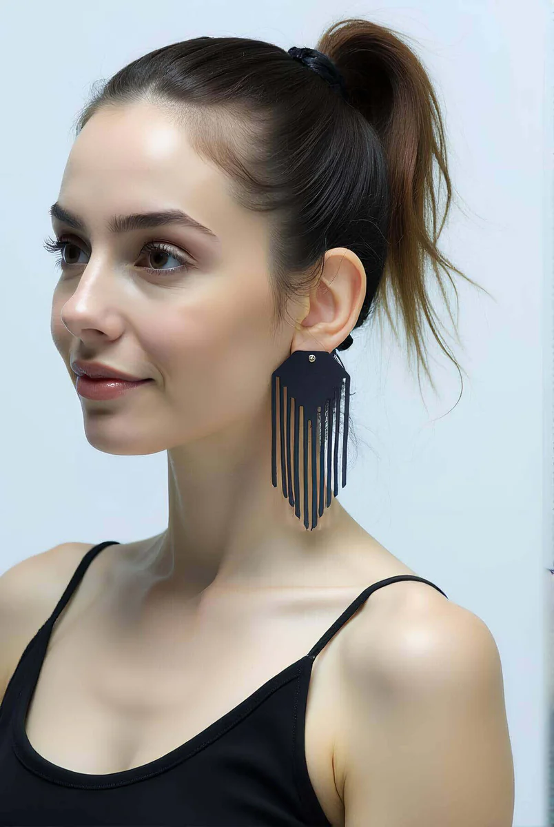 Black Faux Leather Tassel Earrings Laser-Cut Statement Style on Model