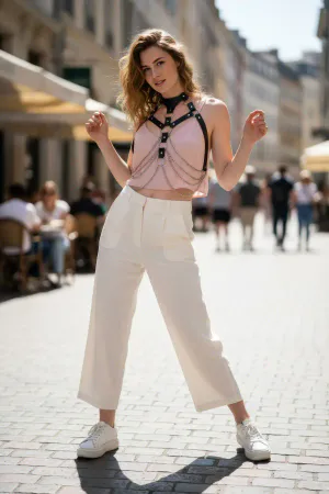 Black Faux Leather Body Harness with Draped Silver Chains Worn Over Pink Top on Street