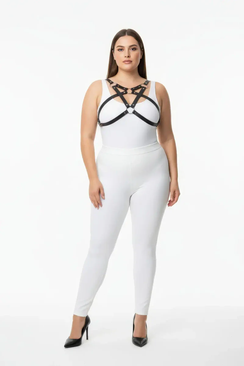 Black vegan leather chest harness with O-ring detail worn by a plus-size model