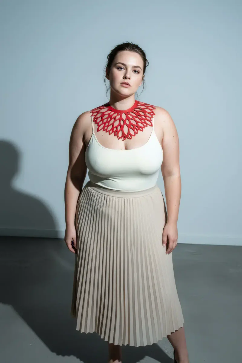 Model wearing red floral laser-cut choker with white top